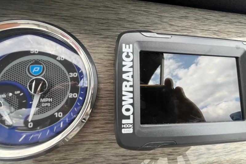 Slide: The Image of Dashboard of 2020 Premier 230 SunSation RF with Lowrance GPS and speedometer. - 44