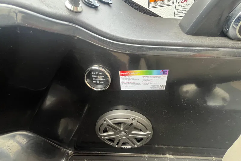 Slide: The Image of Control panel and speaker on 2020 Premier 230 SunSation RF boat dashboard. - 47