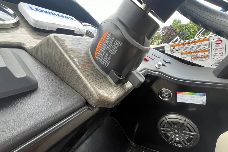 Slide: The Image of Dashboard of 2020 Premier 230 SunSation RF boat with controls and warning labels. - 49