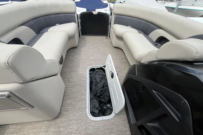 Slide: The Image of 2020 Premier 230 SunSation RF boat interior with open storage compartment. - 51