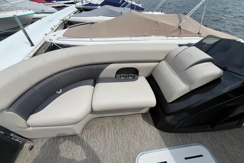 Slide: The Image of 2020 Premier 230 SunSation RF boat interior with luxurious seating and cup holders. - 56