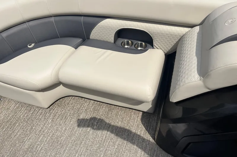 Slide: The Image of Premier 230 SunSation RF 2020 boat interior with cushioned seating and cup holders. - 59