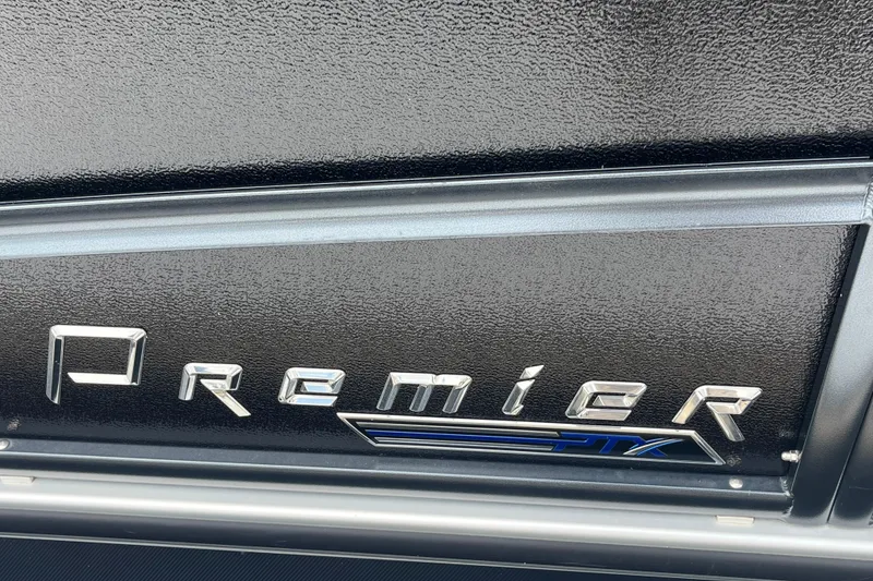 Slide: The Image of 2020 Premier 230 SunSation RF boat logo on textured black surface. - 63