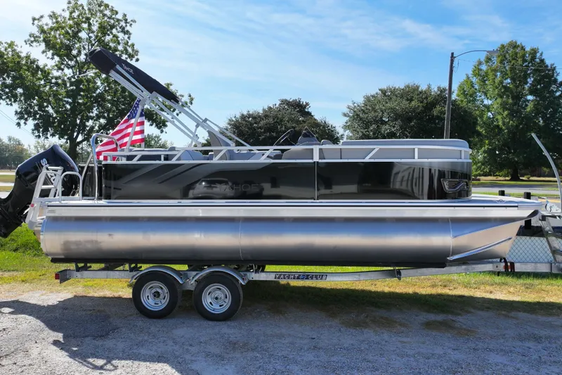 Slide: The Image of 2026 Tahoe Pontoon Sport 85 Cruise dashboard with steering wheel and controls. - 10