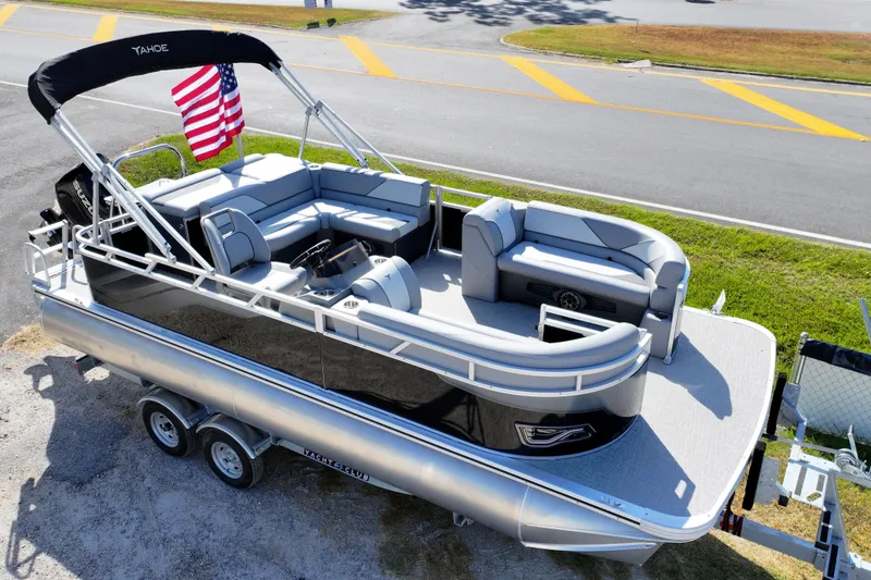 Slide: The Image of 2026 Tahoe Pontoon Sport 85 Cruise interior with gray seating and modern design. - 12
