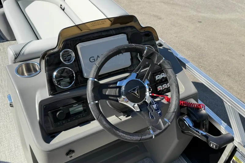 Slide: The Image of 2026 Tahoe Pontoon Sport 85 Cruise on trailer, featuring Suzuki outboard motor and American flag. - 3