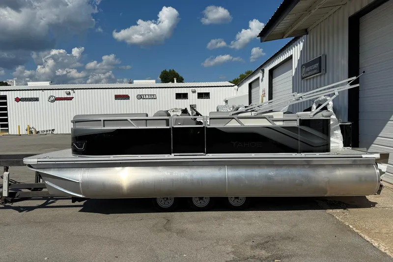 Slide: The Image of 2026 Tahoe Pontoon Sport 85 Cruise, spacious seating, sleek design, parked on grass. - 6