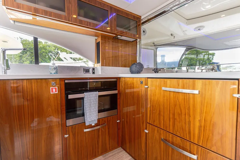 Slide: The Image of Luxurious kitchen interior of 2021 Riviera 5400 Sport Yacht Platinum Edition. - 33