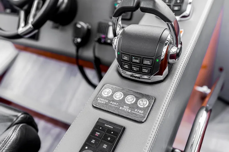 Slide: The Image of Control panel of 2021 Riviera 5400 Sport Yacht Platinum Edition, featuring advanced navigation controls. - 42