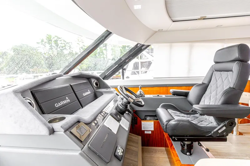 Slide: The Image of Helm of 2021 Riviera 5400 Sport Yacht Platinum Edition with Garmin navigation system. - 45