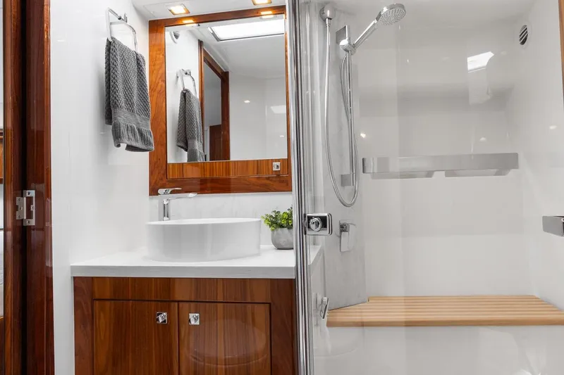 Slide: The Image of Luxurious bathroom in 2021 Riviera 5400 Sport Yacht Platinum Edition with modern fixtures. - 52