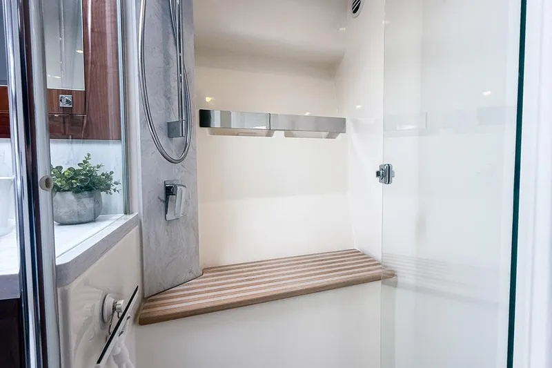 Slide: The Image of Luxurious shower interior of 2021 Riviera 5400 Sport Yacht Platinum Edition. - 55