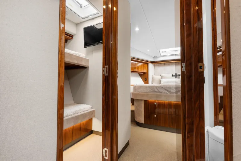 Slide: The Image of Luxurious interior of 2021 Riviera 5400 Sport Yacht Platinum Edition with elegant wood finishes. - 56
