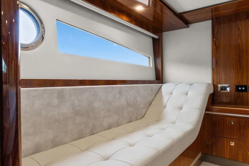 Slide: The Image of Luxurious interior of 2021 Riviera 5400 Sport Yacht Platinum Edition with elegant seating. - 65