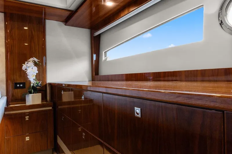 Slide: The Image of Luxurious interior of 2021 Riviera 5400 Sport Yacht Platinum Edition with elegant wood finish. - 66