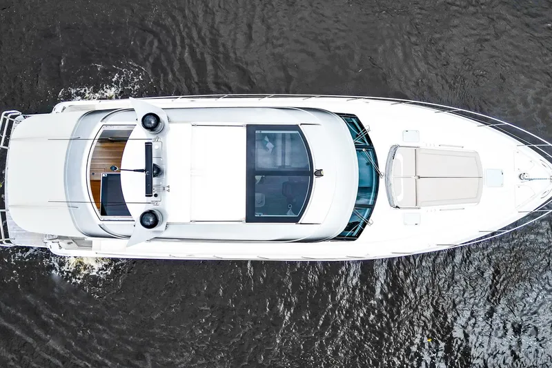 Slide: The Image of Aerial view of 2021 Riviera 5400 Sport Yacht Platinum Edition cruising on water. - 7