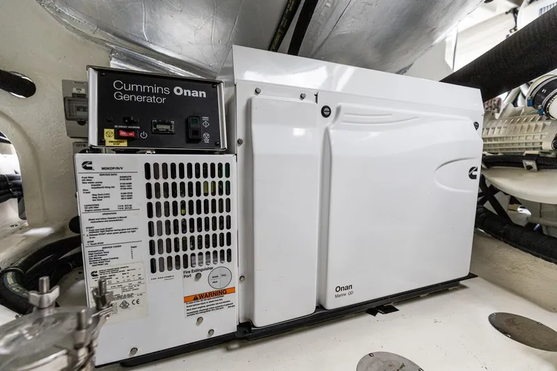 Slide: The Image of Cummins Onan generator in 2021 Riviera 5400 Sport Yacht Platinum Edition engine room. - 74