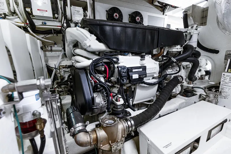 Slide: The Image of Engine room of 2021 Riviera 5400 Sport Yacht Platinum Edition, showcasing advanced machinery and components. - 75