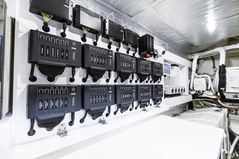 Slide: The Image of Electrical control panel in 2021 Riviera 5400 Sport Yacht Platinum Edition. - 77