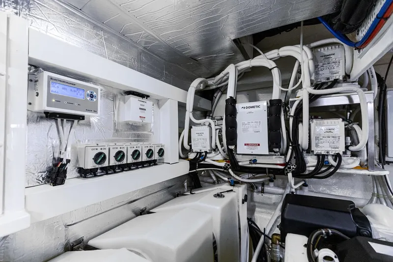 Slide: The Image of Engine room of 2021 Riviera 5400 Sport Yacht Platinum Edition with advanced electrical systems. - 78