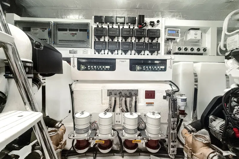 Slide: The Image of Engine room of 2021 Riviera 5400 Sport Yacht Platinum Edition with Fusion Battery system. - 82