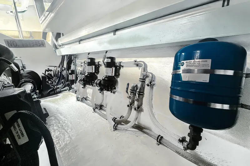 Slide: The Image of Engine room of 2021 Riviera 5400 Sport Yacht Platinum Edition, featuring mechanical components. - 83