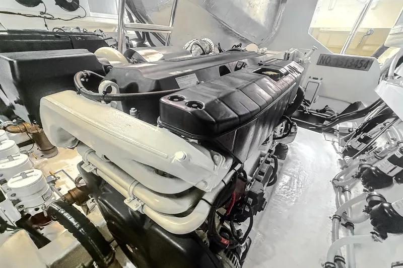 Slide: The Image of Engine room of 2021 Riviera 5400 Sport Yacht Platinum Edition, showcasing powerful machinery. - 85