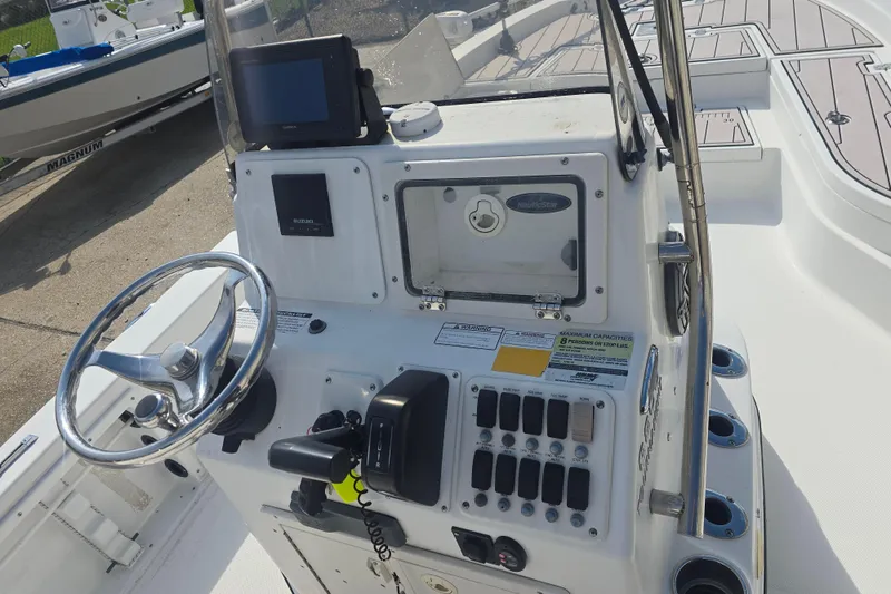 Slide: The Image of 2009 NauticStar 2200 Nautic Bay boat console with steering wheel and control panel. - 7