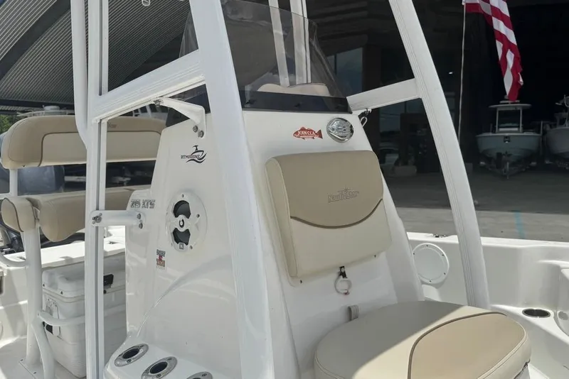 Slide: The Image of 2022 NauticStar 215 XTS boat interior with seating and console details. - 13