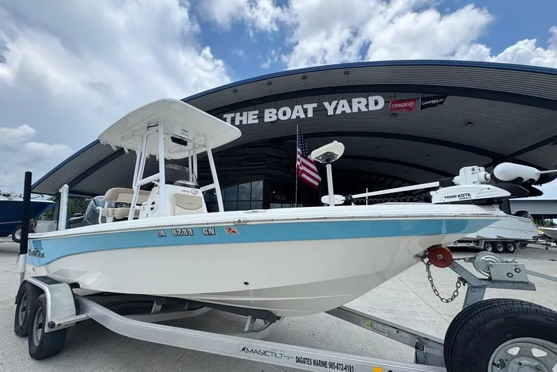 Slide: The Image of 2022 NauticStar 215 XTS boat on trailer at The Boat Yard dealership. - 5