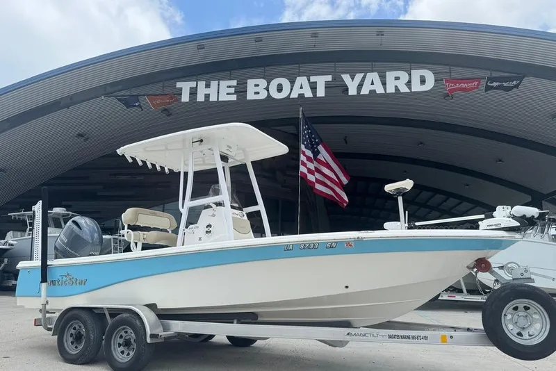 Slide: The Image of 2022 NauticStar 215 XTS boat on trailer at The Boat Yard dealership. - 6
