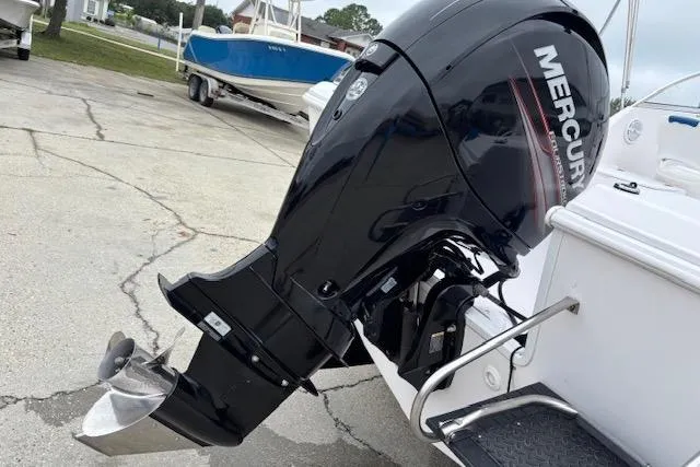 Slide: The Image of 2002 Pro-Line 20 DC boat with Mercury outboard motor in a marina setting. - 3