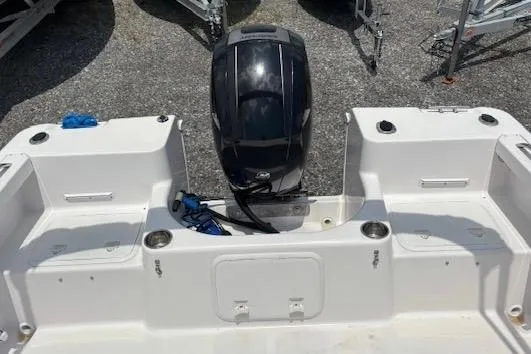 Slide: The Image of 2002 Pro-Line 20 DC boat with outboard motor, viewed from the rear deck. - 4