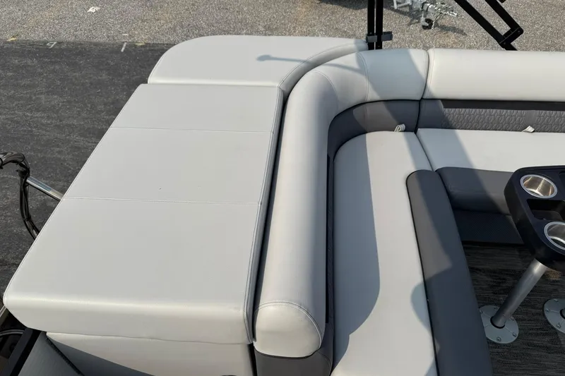 Slide: The Image of 2021 Godfrey Sweetwater 2086 C boat interior with gray seating and cup holders. - 17