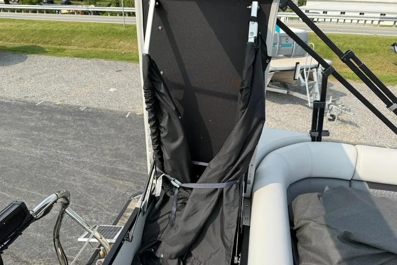 Slide: The Image of 2021 Godfrey Sweetwater 2086 C pontoon boat interior with seating and storage area. - 19