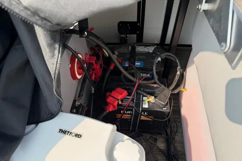 Slide: The Image of Battery compartment of 2021 Godfrey Sweetwater 2086 C pontoon boat. - 20