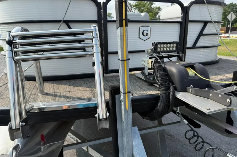 Slide: The Image of 2021 Godfrey Sweetwater 2086 C pontoon boat with ladder and winch on trailer. - 6