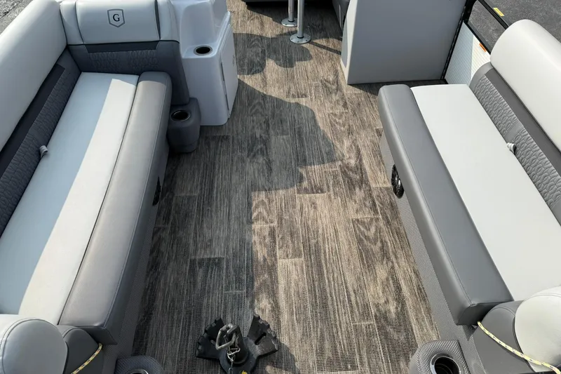 Slide: The Image of 2021 Godfrey Sweetwater 2086 C interior with gray seating and wood-style flooring. - 8