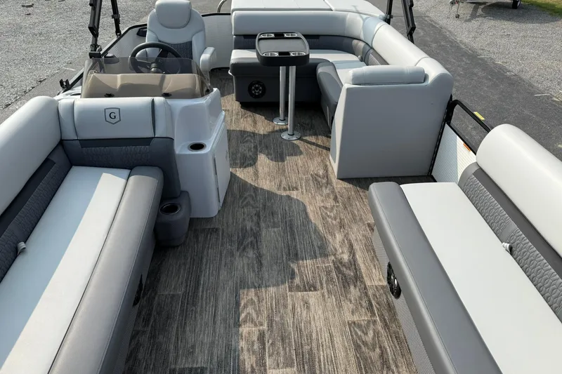 Slide: The Image of 2021 Godfrey Sweetwater 2086 C pontoon boat interior with gray seating and wood-style flooring. - 9