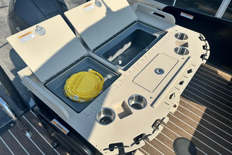 Slide: The Image of Premier 250 Angler 2026 boat deck with storage compartments and cup holders. - 10