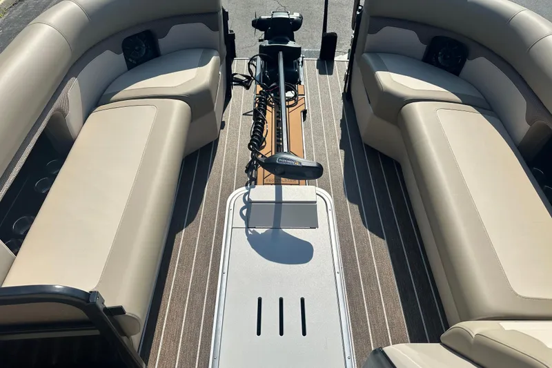 Slide: The Image of 2026 Premier 250 Angler boat interior with beige seating and striped flooring. - 13