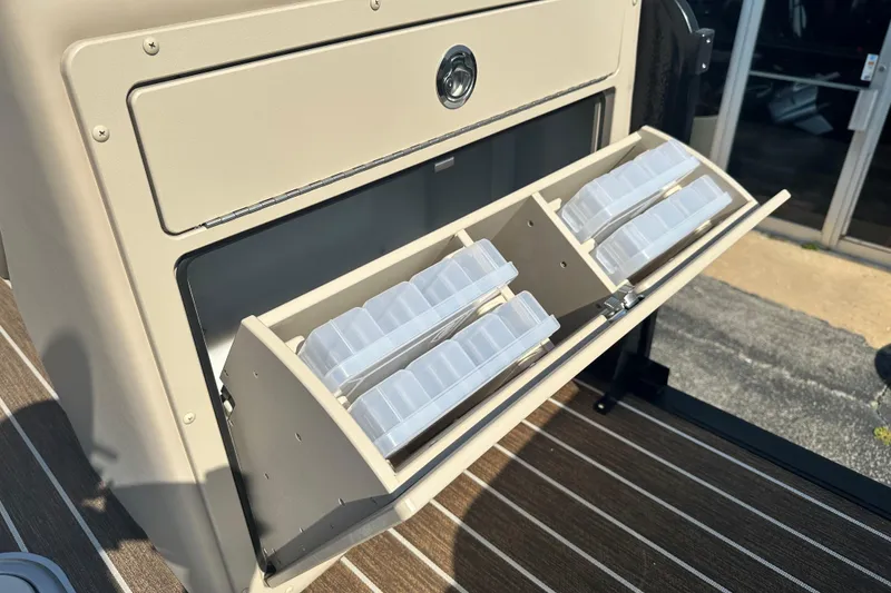 Slide: The Image of Storage compartment with tackle boxes on a 2026 Premier 250 Angler boat. - 16