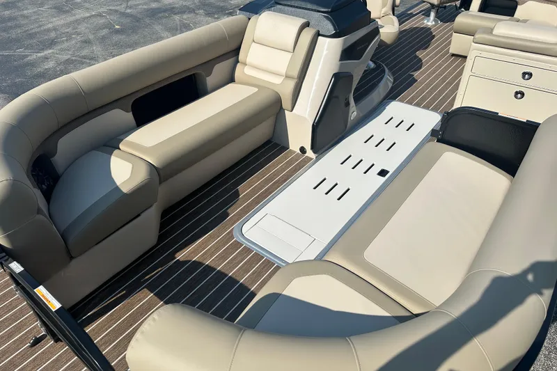 Slide: The Image of Luxurious interior of 2026 Premier 250 Angler boat with beige seating and wood flooring. - 5
