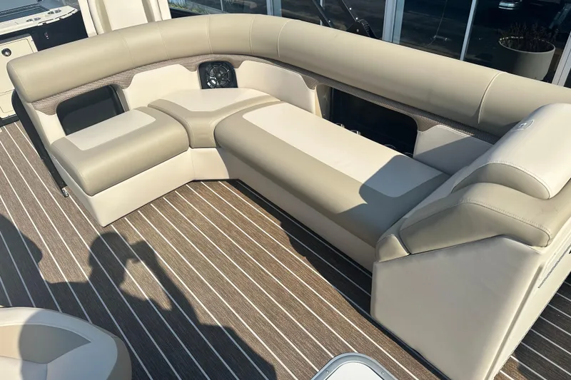 Slide: The Image of Premier 250 Angler 2026 boat interior with beige seating and striped flooring. - 7