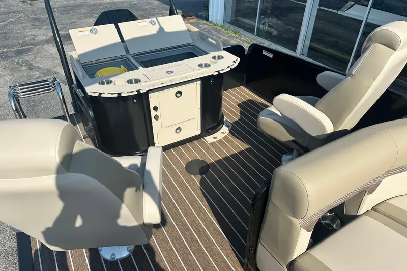 Slide: The Image of 2026 Premier 250 Angler boat interior with beige seating and striped flooring. - 9