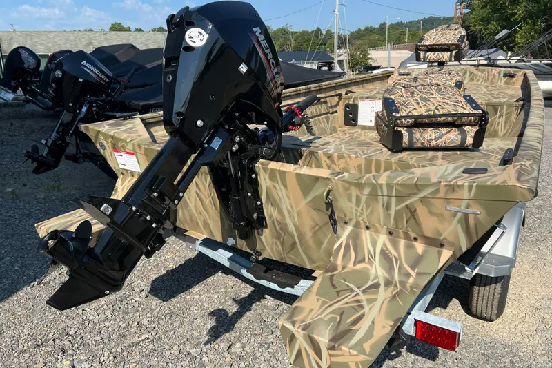 Slide: The Image of 2026 Lund 1660 Predator boat with camouflage design and Mercury outboard motor. - 8