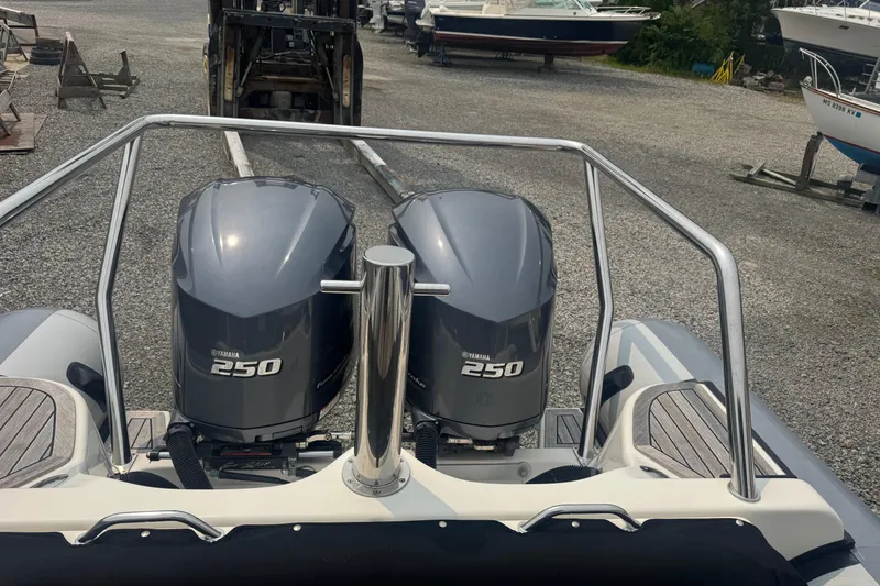 Slide: The Image of 2016 Protector 30 Center Console with twin Yamaha 250 engines in a boatyard. - 11