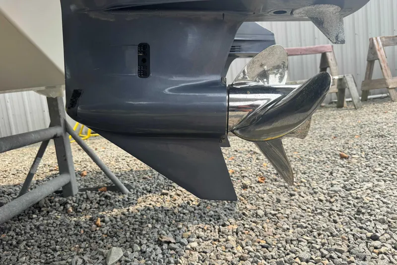 Slide: The Image of Propeller of a 2016 Protector 30 Center Console boat on gravel surface. - 15