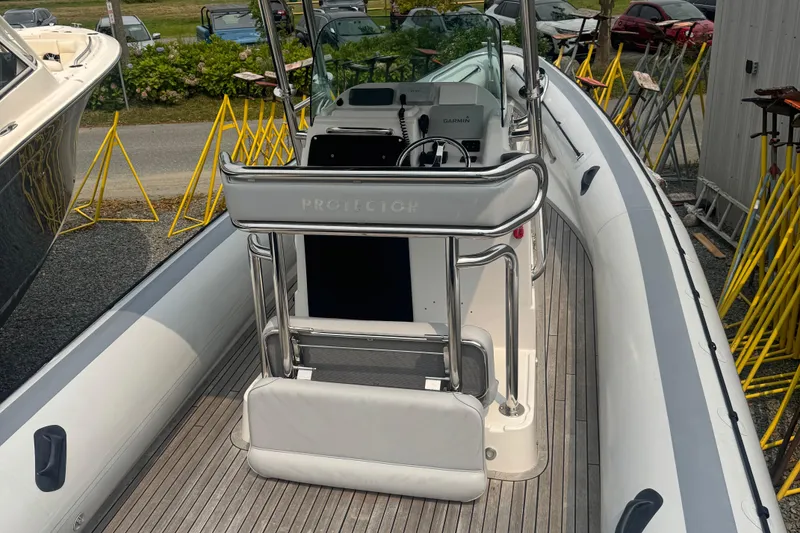 Slide: The Image of 2016 Protector 30 Center Console boat with sleek design and modern controls. - 3