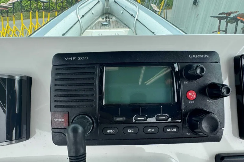 Slide: The Image of Garmin VHF 200 radio on 2016 Protector 30 Center Console boat dashboard. - 5